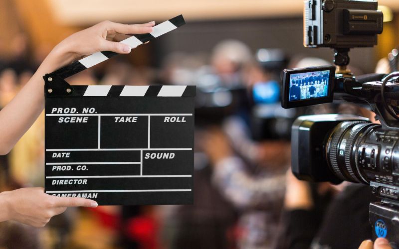 production company clapper board with the video camera